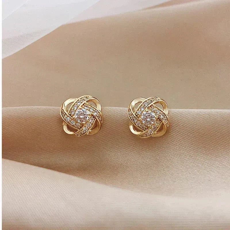 Boucles d'oreilles Croix Spirale Fleur